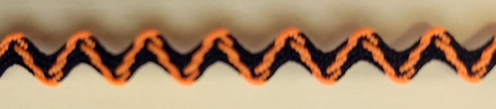 57-432.jpg 5 Yards 1/4" Orange and Black Ric Rac Trim 19884 - Image 1
