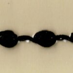 5 Yards 1/4" Black Rosettes with some White Trim 45694